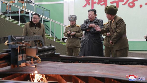 North Korea leader Kim Jong Un visits a munitions factory producing what state media KCNA says is a 
