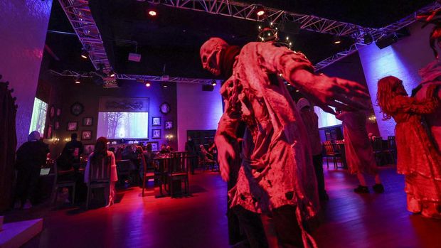 Actors in zombie costumes liven up the atmosphere at the horror-themed 