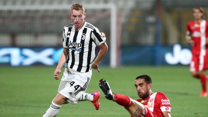 MONZA, ITALY - JULY 31: Dejan Kulusevski of Juventus FC competes for the ball with Giuseppe Bellusci (down) of AC Monza during the AC Monza v Juventus FC - Trofeo Berlusconi at Stadio Brianteo on July 31, 2021 in Monza, Italy. (Photo by Marco Luzzani/Getty Images)