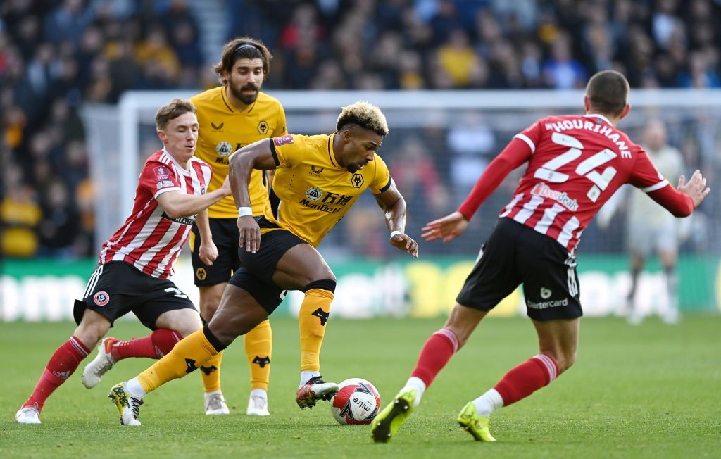 WOLVERHAMPTON, ENGLAND - DECEMBER 01:  Adama Traore of Wolverhampton Wanderers runs with the ball during the Premier League match between Wolverhampton Wanderers and Burnley at Molineux on December 01, 2021 in Wolverhampton, England. (Photo by David Rogers/Getty Images)