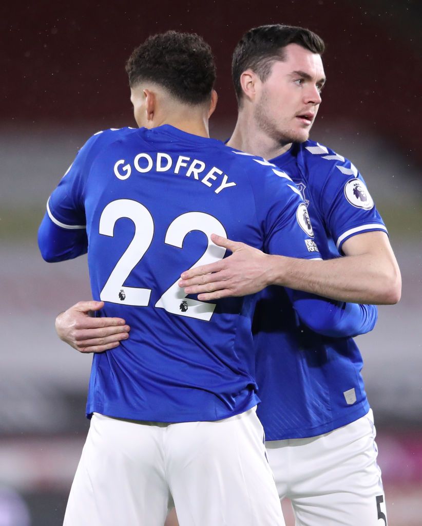 SHEFFIELD, ENGLAND - DECEMBER 26: Ben Godfrey of Everton and Michael Keane of Everton embrace prior to the Premier League match between Sheffield United and Everton at Bramall Lane on December 26, 2020 in Sheffield, England. The match will be played without fans, behind closed doors as a Covid-19 precaution. (Photo by Alex Pantling/Getty Images)