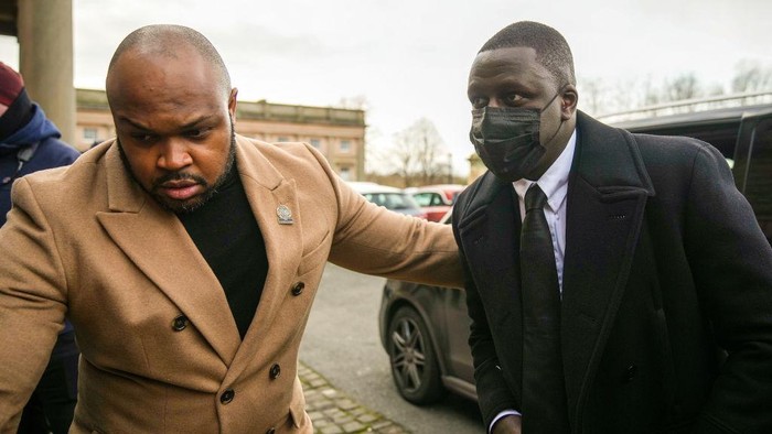 CHESTER, ENGLAND – FEBRUARY 2: Manchester City footballer Benjamin Mendy (R) arrives at Chester Crown Court on February 2, 2022 in Chester, England. Benjamin Mendy, a defender for Manchester City Football Club, is accused of seven counts of rape and one count of sexual assault. The rape charges relate to four different women and the sexual assault charge to a fifth and are alleged to have taken place between October 2020 and August 2021.  (Photo by Christopher Furlong/Getty Images)