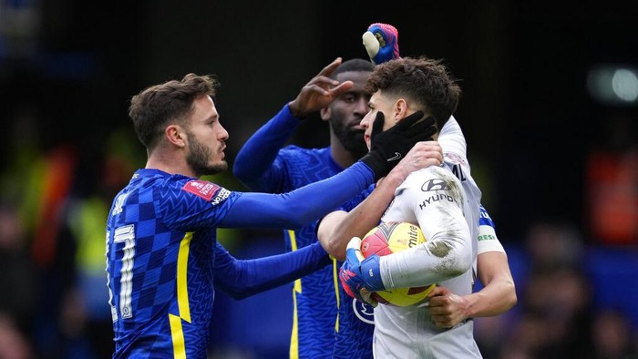 Chelseas goalkeeper Kepa Arrizabalaga, right, celebrates with his teammates after he saved a penalty by Plymouths Ryan Hardie during the English FA Cup fourth round soccer match between Chelsea and Plymouth Argyle at Stamford Bridge Stadium in London, Saturday, Feb. 5, 2022. (AP Photo/Matt Dunham)
