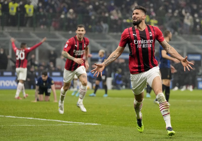 AC Milans Olivier Giroud celebrates after scoring his sides opening goal during the Serie A soccer match between Inter Milan and AC Milan at the San Siro Stadium, in Milan, Italy, Saturday, Feb. 5, 2022. (AP Photo/Antonio Calanni)