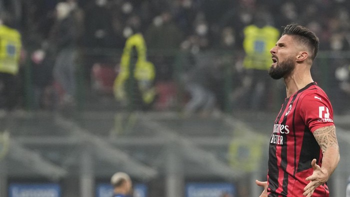 AC Milans Olivier Giroud celebrates after scoring his sides opening goal during the Serie A soccer match between Inter Milan and AC Milan at the San Siro Stadium, in Milan, Italy, Saturday, Feb. 5, 2022. (AP Photo/Antonio Calanni)