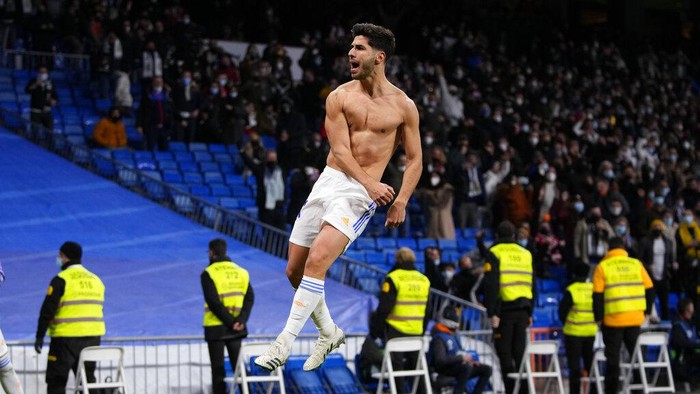 Real Madrids Marco Asensio celebrates after scoring during a Spanish La Liga soccer match between Real Madrid and Granada at the Bernabeu stadium in Madrid, Spain, Sunday, Feb. 6, 2022. (AP Photo/Manu Fernandez)
