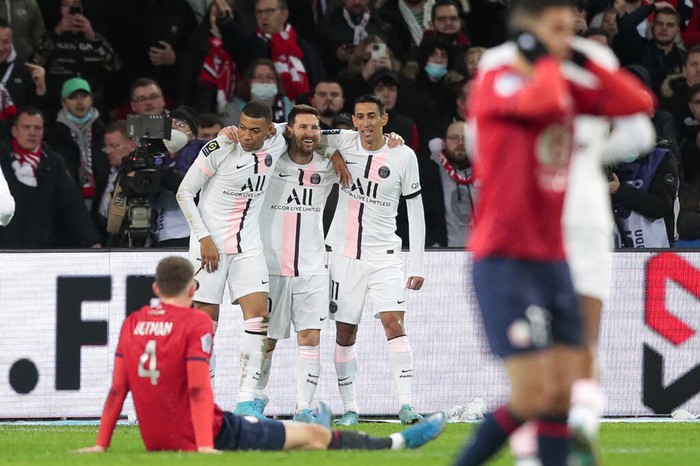 PSGs Lionel Messi, third from left, celebrates with his teammates after scoring his sides third goal during the French League One soccer match between Lille and Paris Saint Germain at Pierre Mauroy stadium in Villeneuve dAscq in Lille, France, Sunday, Feb. 6, 2022. (AP Photo/Michel Spingler)