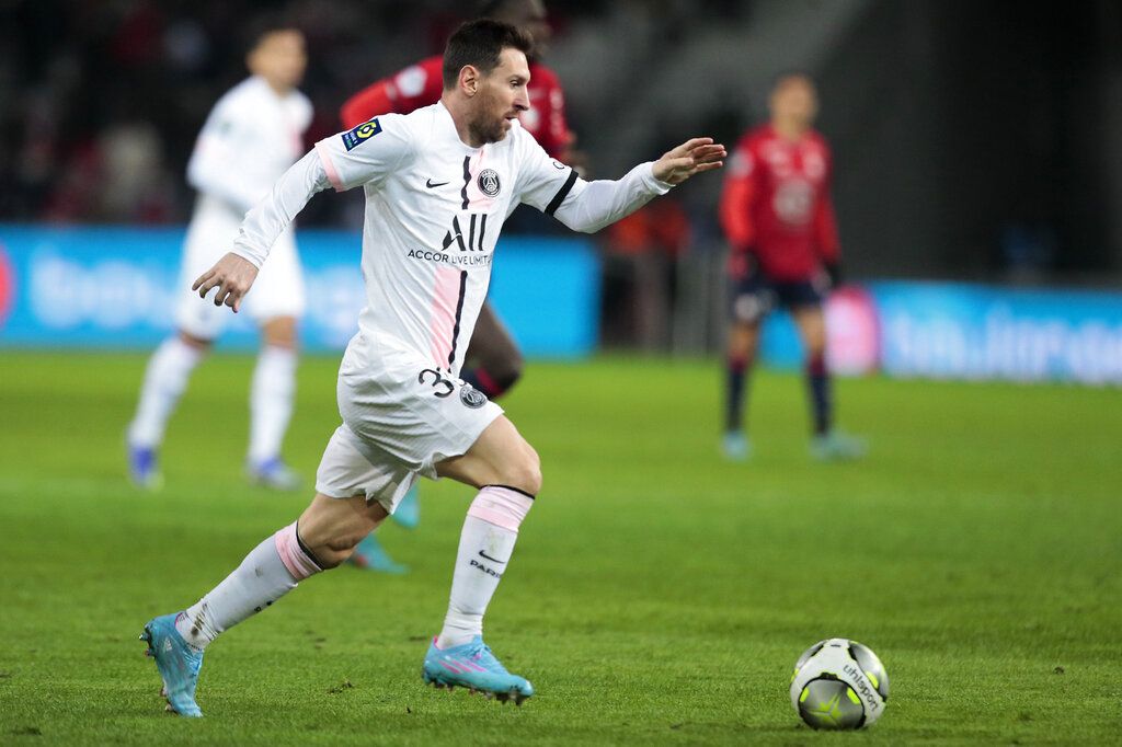 PSG's Lionel Messi, third from left, celebrates with his teammates after scoring his side's third goal during the French League One soccer match between Lille and Paris Saint Germain at Pierre Mauroy stadium in Villeneuve d'Ascq in Lille, France, Sunday, Feb. 6, 2022. (AP Photo/Michel Spingler)
