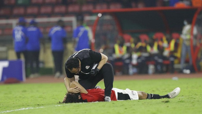 Egyptian players react after the African Cup of Nations 2022 final soccer match between Senegal and Egypt at the Ahmadou Ahidjo stadium in Yaounde, Cameroon, Sunday, Feb. 6, 2022. (AP Photo/Sunday Alamba)