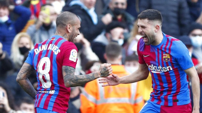 Dani Alves Barcelona's Jordi Alba, right, celebrates after scoring his side's opening goal with Barcelona's Dani Alves during a Spanish La Liga soccer match between FC Barcelona and Atletico Madrid at the Camp Nou stadium in Barcelona, Spain, Sunday, Feb. 6, 2022. (AP Photo/Joan Monfort)