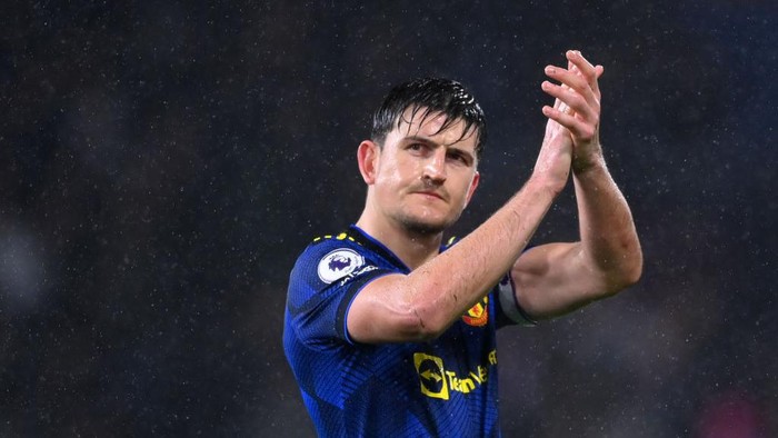 BURNLEY, ENGLAND - FEBRUARY 08: Harry Maguire of Manchester United applauds fans following their draw in the Premier League match between Burnley and Manchester United at Turf Moor on February 08, 2022 in Burnley, England. (Photo by Laurence Griffiths/Getty Images)