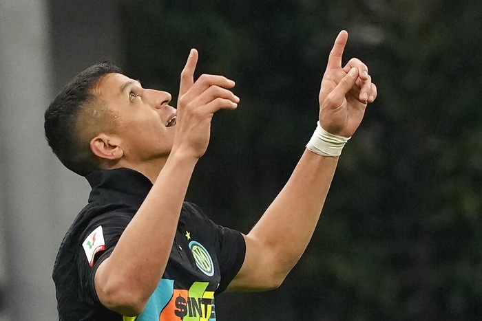Inter Milans Alexis Sanchez celebrates after scores against Roma during the Italian Cup soccer match between Inter Milan and Roma at the San Siro stadium, in Milan, Italy, on Tuesday, Feb. 8, 2022. (AP Photo/Antonio Calanni)