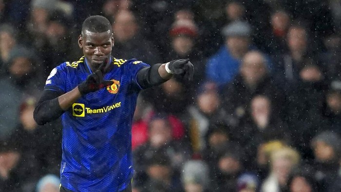 Manchester Uniteds Paul Pogba celebrates after scoring his sides opening goal during the English Premier League soccer match between Burnley and Manchester United at Turf Moor, in Burnley, England, Tuesday, Feb. 8, 2022. (AP Photo/Jon Super)