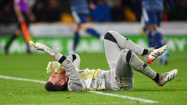 WOLVERHAMPTON, ENGLAND - FEBRUARY 10: Jose Sa of Wolverhampton Wanderers lies injured after conceding their first goal during the Premier League match between Wolverhampton Wanderers and Arsenal at Molineux on February 10, 2022 in Wolverhampton, England. (Photo by Clive Mason/Getty Images)