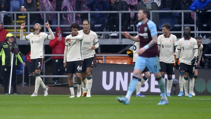 Liverpools Fabinho, left, celebrates after scoring his sides opening goal during the English Premier League soccer match between Burnley and Liverpool at Turf Moor, in Burnley, England, Sunday, Feb. 13, 2022. (AP Photo/Jon Super)