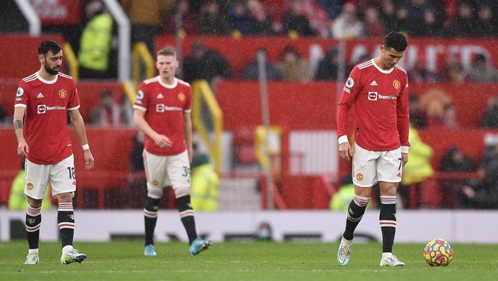 MANCHESTER, ENGLAND - FEBRUARY 12: Cristiano Ronaldo of Manchester United reacts after Che Adams of Southampton (not pictured) scored their sides first goal during the Premier League match between Manchester United and Southampton at Old Trafford on February 12, 2022 in Manchester, England. (Photo by Nathan Stirk/Getty Images)