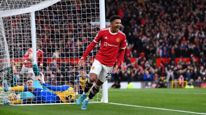 MANCHESTER, ENGLAND - FEBRUARY 12: Jadon Sancho of Manchester United celebrates after scoring their teams first goal during the Premier League match between Manchester United and Southampton at Old Trafford on February 12, 2022 in Manchester, England. (Photo by Laurence Griffiths/Getty Images)