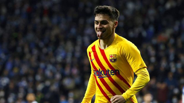 Espanyol vs Barcelona Barcelona's Pedri celebrates after scoring the opening goal during a Spanish La Liga soccer match between RCD Espanyol and Barcelona at the Cornella-El Prat stadium in Barcelona, Spain, Sunday, Feb. 13, 2022. (AP Photo/Joan Monfort)