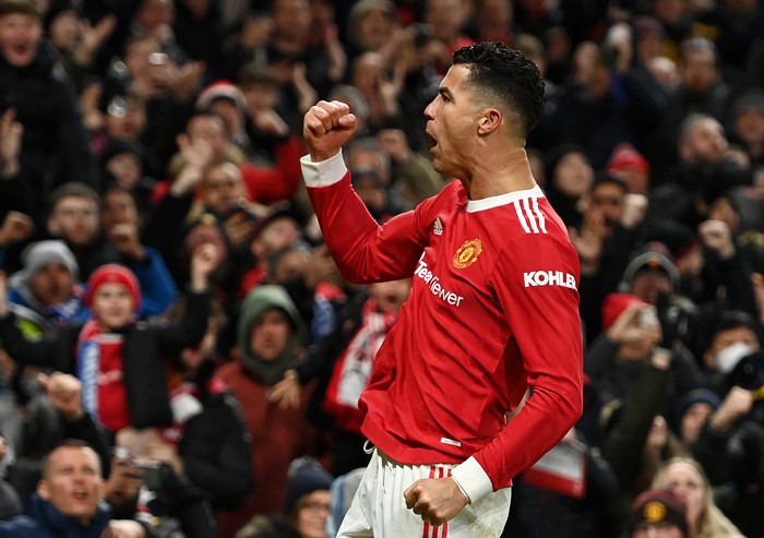 MANCHESTER, ENGLAND - FEBRUARY 15: Cristiano Ronaldo of Manchester United celebrates after scoring their teams first goal during the Premier League match between Manchester United and Brighton & Hove Albion at Old Trafford on February 15, 2022 in Manchester, England. (Photo by Gareth Copley/Getty Images)