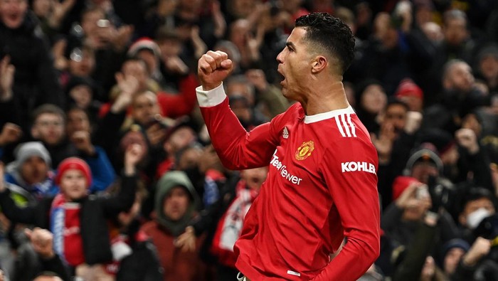 MANCHESTER, ENGLAND - FEBRUARY 15: Cristiano Ronaldo of Manchester United celebrates after scoring their teams first goal during the Premier League match between Manchester United and Brighton & Hove Albion at Old Trafford on February 15, 2022 in Manchester, England. (Photo by Gareth Copley/Getty Images)