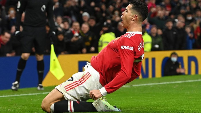 MANCHESTER, ENGLAND - FEBRUARY 15: Cristiano Ronaldo of Manchester United celebrates after scoring their teams first goal during the Premier League match between Manchester United and Brighton & Hove Albion at Old Trafford on February 15, 2022 in Manchester, England. (Photo by Gareth Copley/Getty Images)
