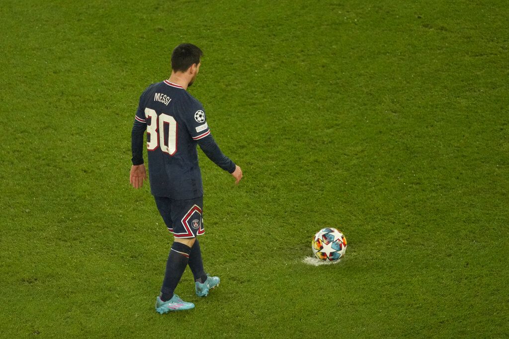 PSG's Lionel Messi looks on during warm up before the Champions League, round of 16, first leg soccer match between Paris Saint Germain and Real Madrid at the Parc des Princes stadium, in Paris, France, Tuesday, Feb. 15, 2022. (AP Photo/Thibault Camus)