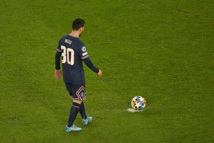 Lionel Messi PSG's Lionel Messi looks on during warm up before the Champions League, round of 16, first leg soccer match between Paris Saint Germain and Real Madrid at the Parc des Princes stadium, in Paris, France, Tuesday, Feb. 15, 2022. (AP Photo/Thibault Camus)