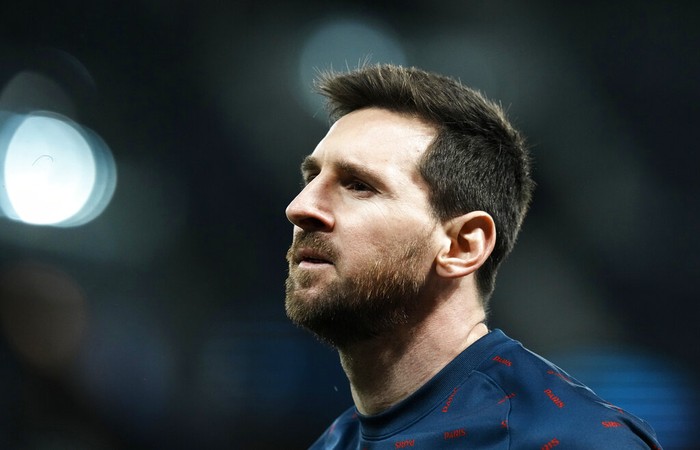 PSGs Lionel Messi looks on during warm up before the Champions League, round of 16, first leg soccer match between Paris Saint Germain and Real Madrid at the Parc des Princes stadium, in Paris, France, Tuesday, Feb. 15, 2022. (AP Photo/Thibault Camus)
