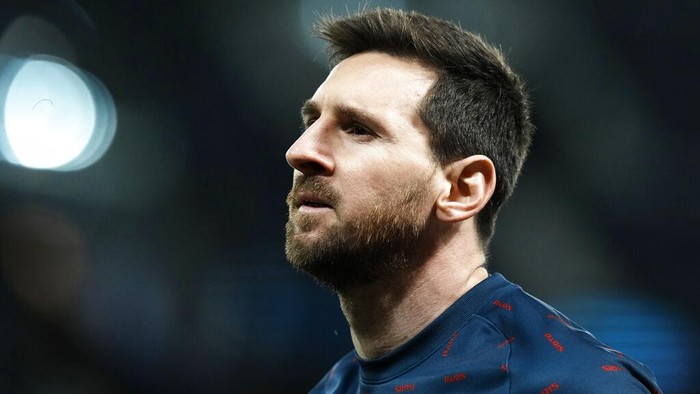 PSGs Lionel Messi looks on during warm up before the Champions League, round of 16, first leg soccer match between Paris Saint Germain and Real Madrid at the Parc des Princes stadium, in Paris, France, Tuesday, Feb. 15, 2022. (AP Photo/Thibault Camus)
