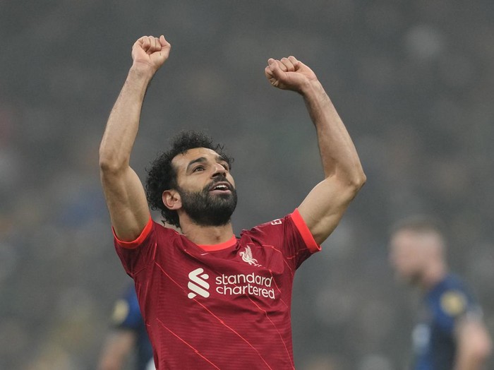 Liverpool's Mohamed Salah celebrates after scoring his side's second goal during the Champions League, round of 16, first leg soccer match between Inter Milan and Liverpool at the San Siro stadium in Milan, Italy, Wednesday, Feb. 16, 2022. (AP Photo/Antonio Calanni)