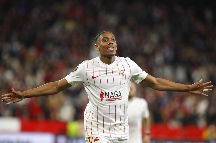 Sevillas Anthony Martial celebrates after scoring his sides third goal during the Europa League soccer match between Sevilla and Dinamo Zagreb at the Ramon Sanchez-Pizjuan Stadium in Seville, Spain, Thursday, Feb. 17, 2022. (AP Photo/Miguel Morenatti)