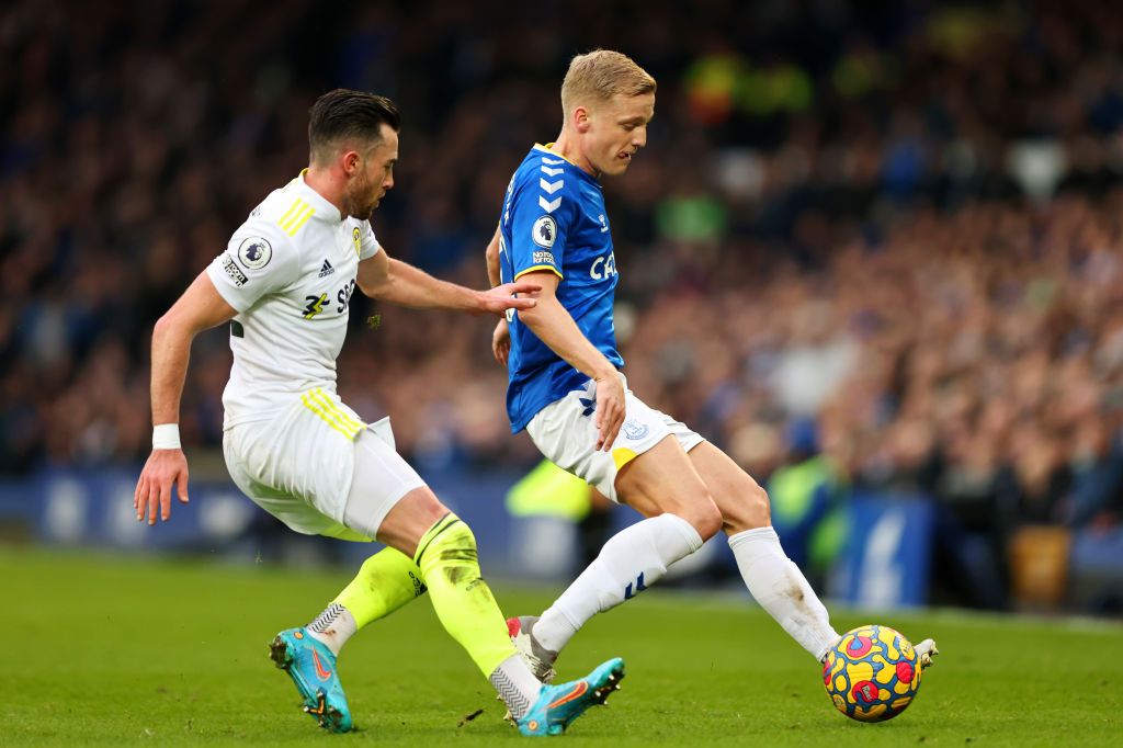 LIVERPOOL, ENGLAND - FEBRUARY 12: Donny van de Beek of Everton battles for possession with Jack Harrison of Leeds United during the Premier League match between Everton and Leeds United at Goodison Park on February 12, 2022 in Liverpool, England. (Photo by Marc Atkins/Getty Images)