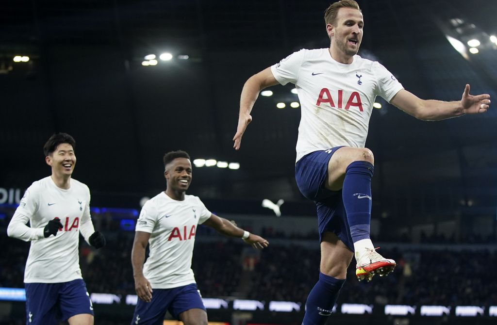 Tottenham's Harry Kane, right, celebrates after scores a disallowed goal during the English Premier League soccer match between Manchester City and Tottenham Hotspur, at the Etihad stadium in Manchester, England, Saturday, Feb. 19, 2022. (AP Photo/Jon Super)