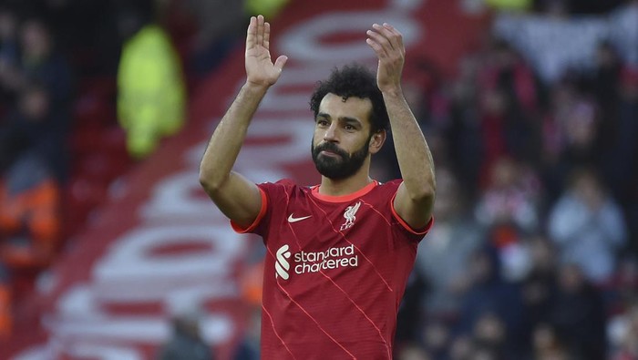 Liverpools Mohamed Salah applauds the fans after the end of the English Premier League soccer match between Liverpool and Norwich City and at Anfield stadium in Liverpool, England, Saturday, Feb. 19, 2022. Liverpool won the game 3-1.(AP Photo/Rui Vieira)