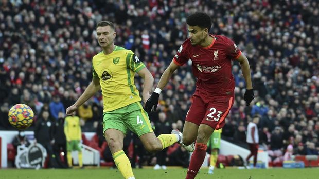 Liverpool's Luis Diaz, right, shoots and scores his sides 3rd goal during the English Premier League soccer match between Liverpool and Norwich City and at Anfield stadium in Liverpool, England, Saturday, Feb. 19, 2022. (AP Photo/Rui Vieira)