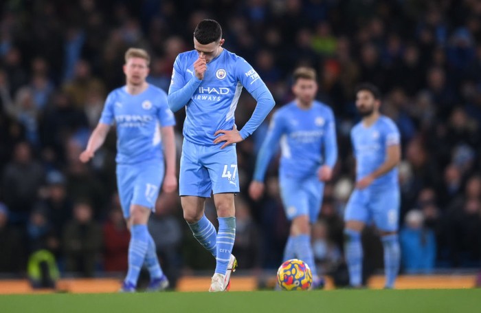 MANCHESTER, ENGLAND - FEBRUARY 19: Phil Foden of Manchester City dejected after their side conceded their third goal during the Premier League match between Manchester City and Tottenham Hotspur at Etihad Stadium on February 19, 2022 in Manchester, England. (Photo by Laurence Griffiths/Getty Images)