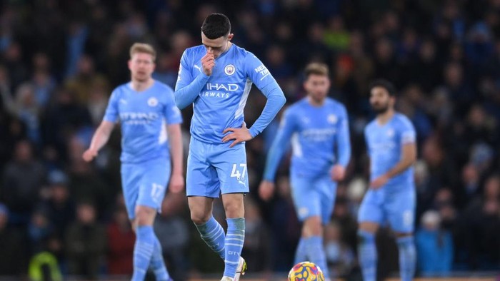 MANCHESTER, ENGLAND - FEBRUARY 19: Phil Foden of Manchester City dejected after their side conceded their third goal during the Premier League match between Manchester City and Tottenham Hotspur at Etihad Stadium on February 19, 2022 in Manchester, England. (Photo by Laurence Griffiths/Getty Images)