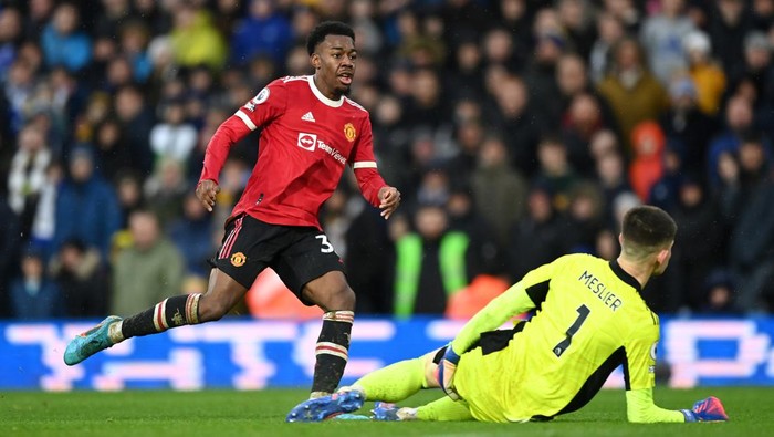 LEEDS, ENGLAND - FEBRUARY 20: Anthony Elanga of Manchester United scores their teams fourth goal past Illan Meslier of Leeds United during the Premier League match between Leeds United and Manchester United at Elland Road on February 20, 2022 in Leeds, England. (Photo by Shaun Botterill/Getty Images)