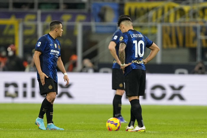 Inter Milan vs Sassuolo Inter Milan's Lautaro Martinez, right, reacts after Sassuolo's Giacomo Raspadori scored his side's opening goal during the Serie A soccer match between Inter Milan and Sassuolo at the San Siro Stadium, in Milan, Italy, Sunday, Feb. 20, 2022. (AP Photo/Antonio Calanni)