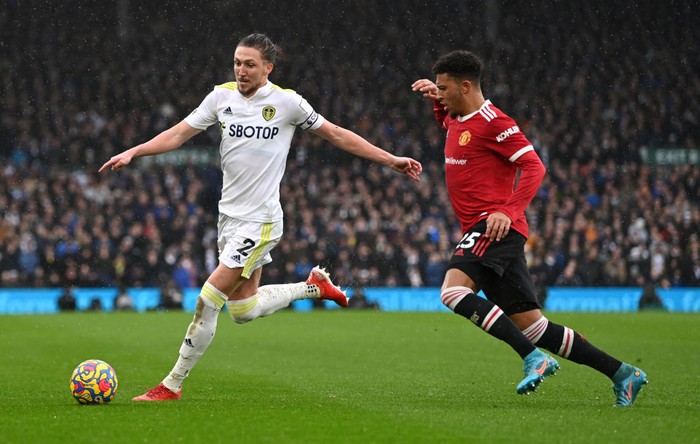 LEEDS, ENGLAND - FEBRUARY 20: Bruno Fernandes celebrates with Victor Lindeloef and Jadon Sancho of Manchester United after scoring their team's second goal during the Premier League match between Leeds United and Manchester United at Elland Road on February 20, 2022 in Leeds, England. (Photo by Laurence Griffiths/Getty Images)
