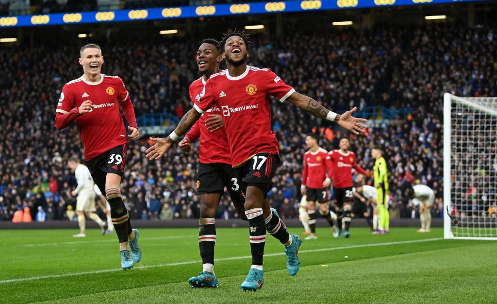 LEEDS, ENGLAND - FEBRUARY 20: Fred celebrates with Anthony Elanga and Scott McTominay of Manchester United after scoring their team's third goal during the Premier League match between Leeds United and Manchester United at Elland Road on February 20, 2022 in Leeds, England. (Photo by Shaun Botterill/Getty Images)