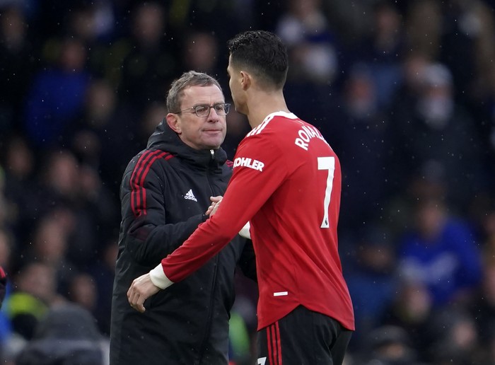 Manchester Uniteds interim manager Ralf Rangnick, left, shakes hands with Manchester Uniteds Cristiano Ronaldo during the English Premier League soccer match between Leeds United and Manchester United, at Elland Road Stadium in Leeds, England, Sunday, Feb. 20, 2022. (AP Photo/Jon Super)