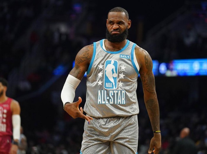 Los Angeles Lakers' LeBron James reacts to celebrities in the front row as he plays in the first half of the NBA All-Star basketball game, Sunday, Feb. 20, 2022, in Cleveland. (AP Photo/Charles Krupa)
