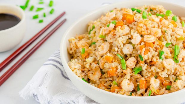 Chinese Shrimp Fried Rice, Popular Chinese Take Out Food, in a Bowl with Chopsticks and Soy Sauce