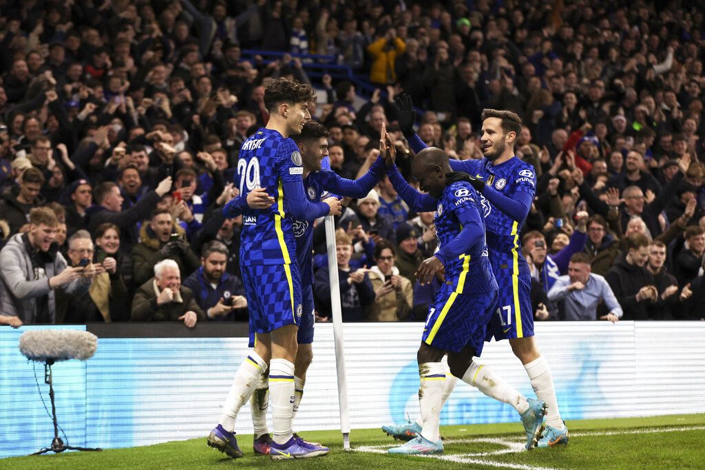 Lille's Sven Botman, right, vies for the ball with Chelsea's Hakim Ziyech, center, during the Champions League round of 16, first leg, soccer match between Chelsea and LOSC Lille at Stamford Bridge stadium in London, Tuesday, Feb. 22, 2022. (AP Photo/Ian Walton)