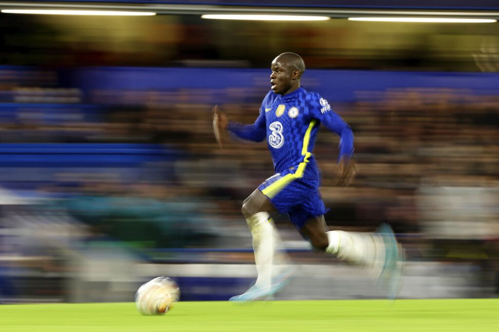 Chelsea's N'Golo Kante runs with the ball during the Champions League round of 16, first leg, soccer match between Chelsea and LOSC Lille at Stamford Bridge stadium in London, Tuesday, Feb. 22, 2022. (AP Photo/Ian Walton)