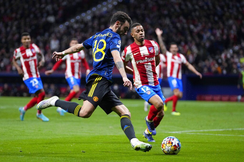 Manchester United's Bruno Fernandes takes a shot during the Champions League, round of 16, first leg soccer match between Atletico Madrid and Manchester United at the Wanda Metropolitano stadium in Madrid, Spain, Wednesday, Feb. 23, 2022. (AP Photo/Manu Fernandez)