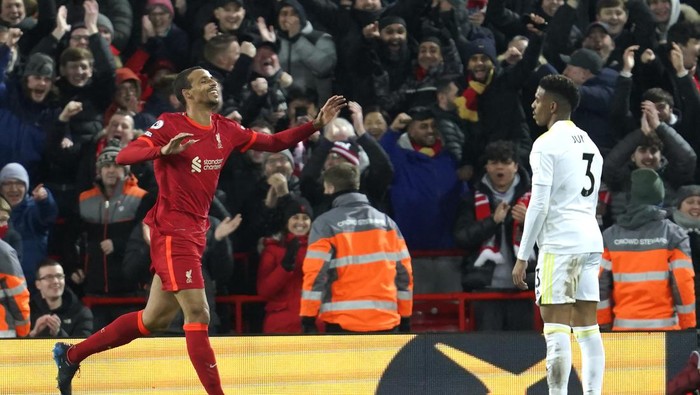 Liverpools Joel Matip, left, celebrates after scoring against Leeds United during the English Premier League soccer match between Liverpool and Leeds United at Anfield stadium in Liverpool, England, Wednesday, Feb. 23, 2022. (AP Photo/Jon Super)