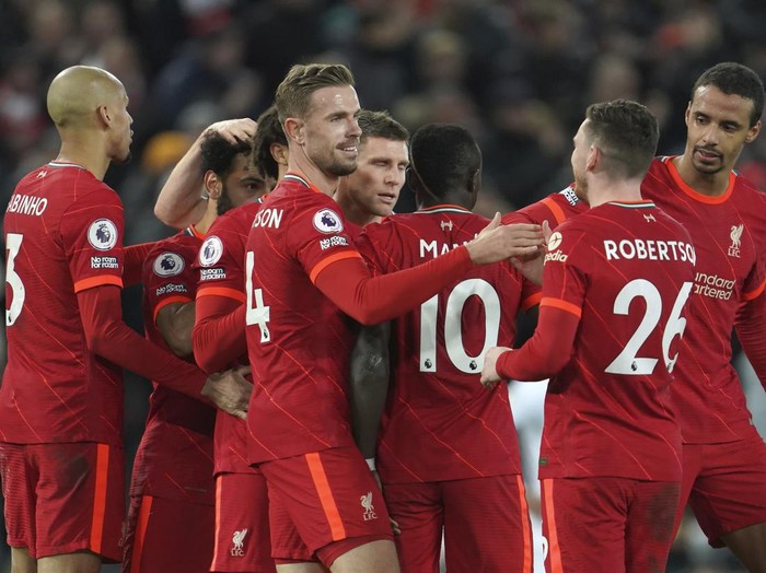 Liverpool's Sadio Mane, center, celebrates his goal with his teammates against Leeds United during the English Premier League soccer match between Liverpool and Leeds United at Anfield stadium in Liverpool, England, Wednesday, Feb. 23, 2022. (AP Photo/Jon Super)