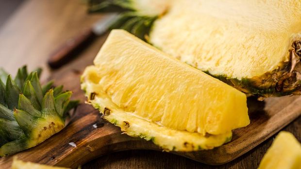 Sliced Pineapple on Chopping Board